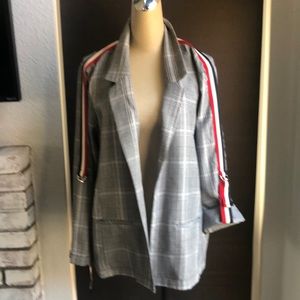 Plaid blazer with red white and blue strips.